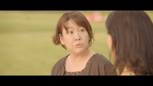 Two women having a conversation outdoors