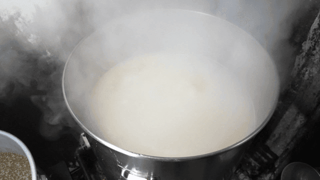 White broth pot with open lid