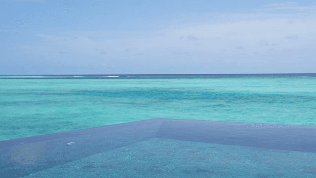 A tranquil sea with clear blue water