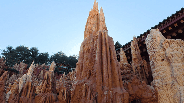 Natural rock formation in front of traditional Hanok