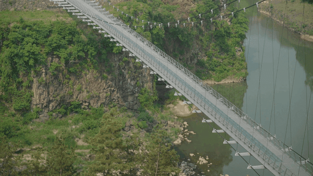 Suspension bridge over scenic canyon
