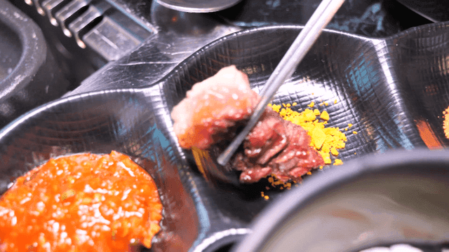 Grilled beef dipped in turmeric salt