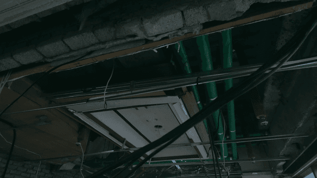 Interior construction with exposed ceiling pipes