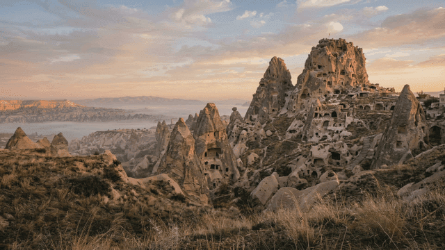 Uchisar Castle, formed by rocks in fog