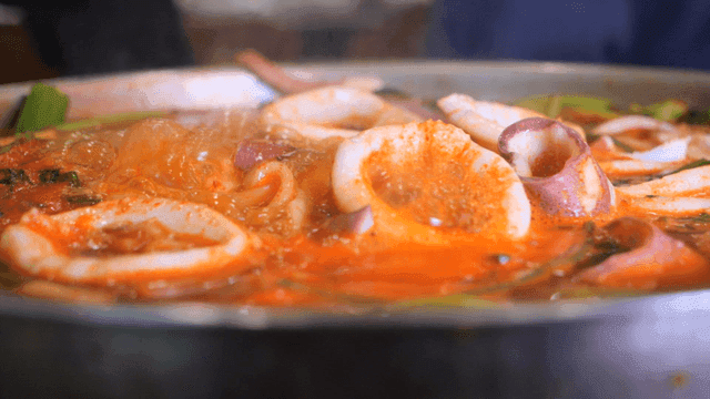 Spicy squid kalguksu boiling in pot