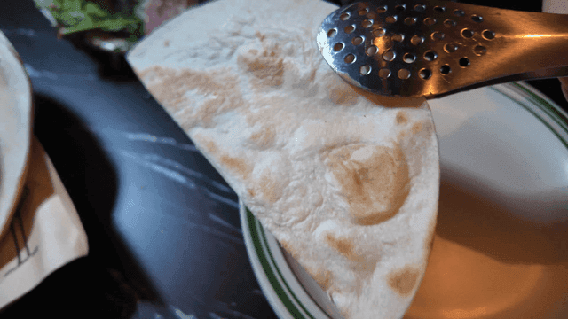 Various breads and tortillas on plate