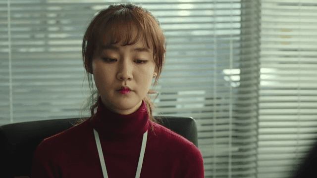 Woman with a tense expression in the office