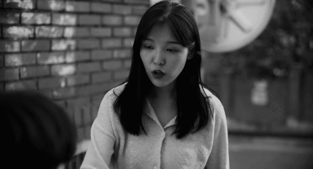 Woman talking to man outdoors