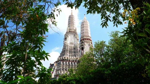 Majestic temple towers framed by lush greenery