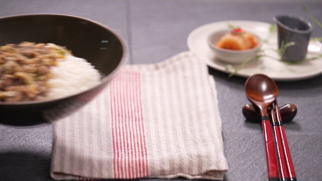 Bulgogi rice bowl on a neatly set table