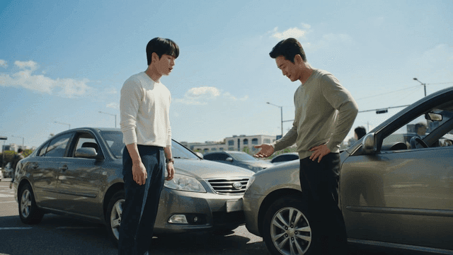 Two men discussing after minor traffic accident