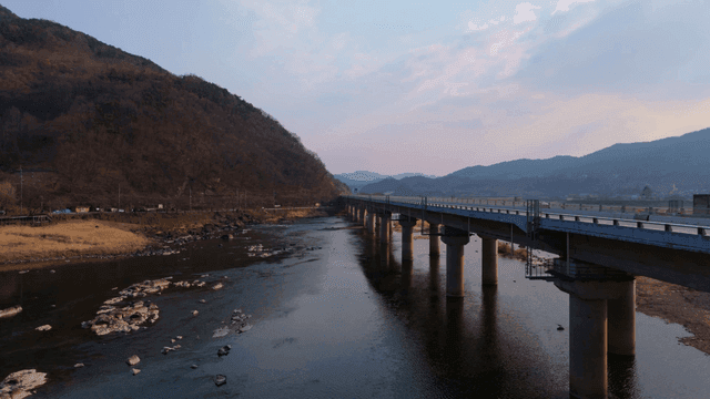 Bridge over mountain and river