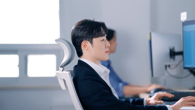 Man smiling while working in the office