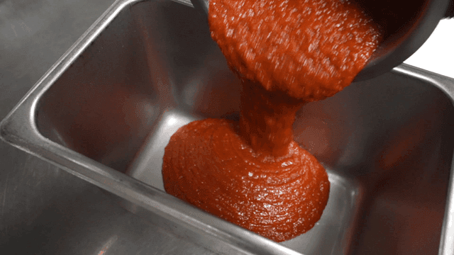 Tomato sauce poured into metal tray
