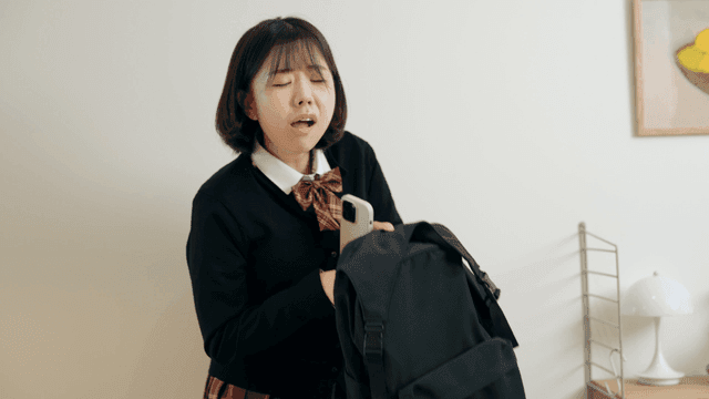 Female student rushes to school after eating lunch.