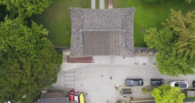 Traditional Korean building surrounded by trees