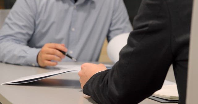 Professionals engaged in a business meeting