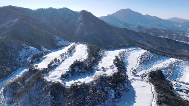 Snowy Mountain Landscape with Winding Roads