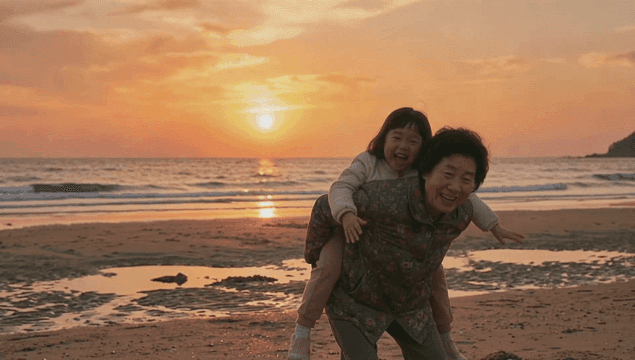 Grandmother and granddaughter enjoying joyful piggyback ride on beach at sunset