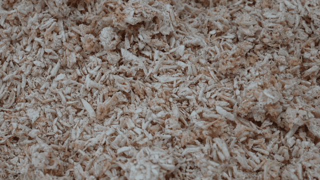 Finely chopped dried fish powder in metal tray