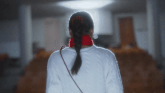 Woman slowly walks onto the stage