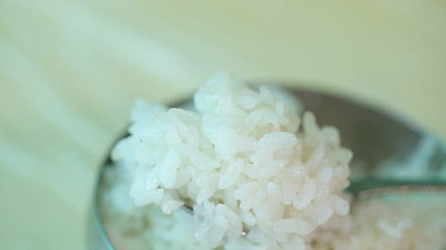 Sweet potato stem salad on top of rice