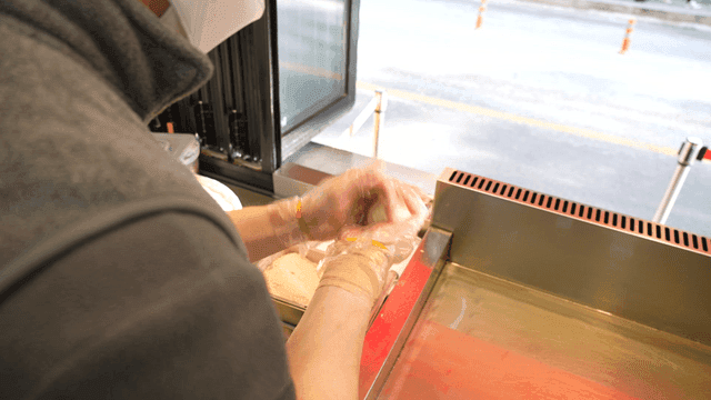 Hotteok dough going onto griddle
