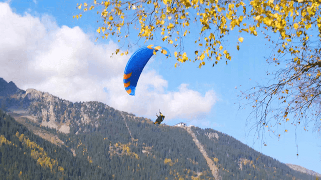 Paragliding over a scenic mountain landscape