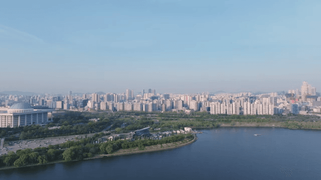 A cityscape with a river and buildings