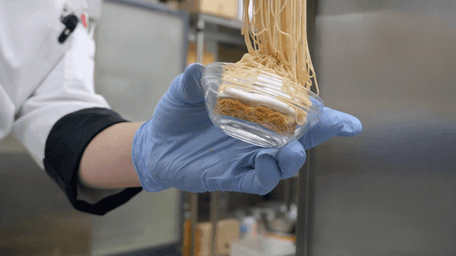 Chef preparing a dessert with precision