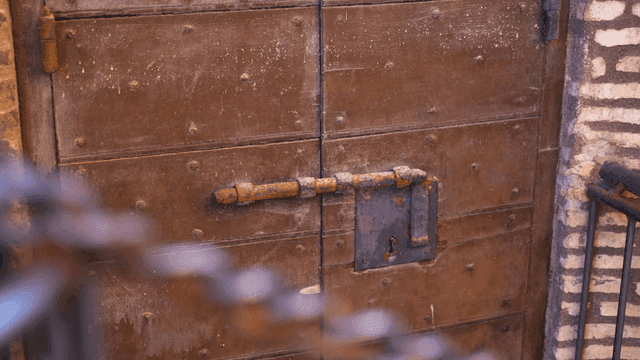 Rustic wooden door with metal latch