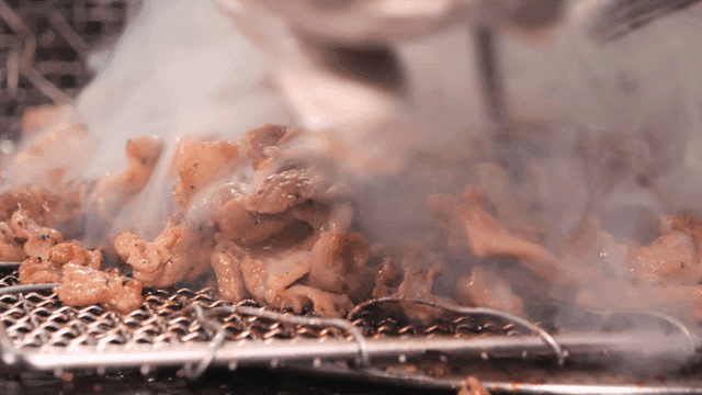 Sizzling briquette bulgogi on grill