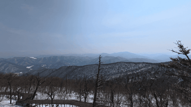 Snow-covered mountains under a clear sky