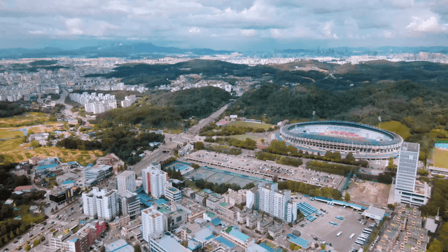 Aerial view of a city with a stadium