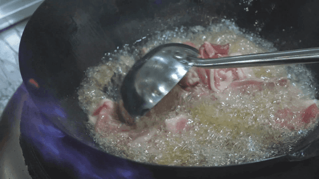 Meat fried in hot oil in pan