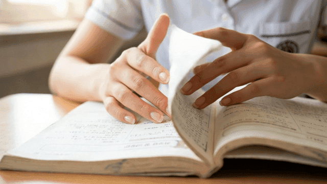 Students studying with textbooks