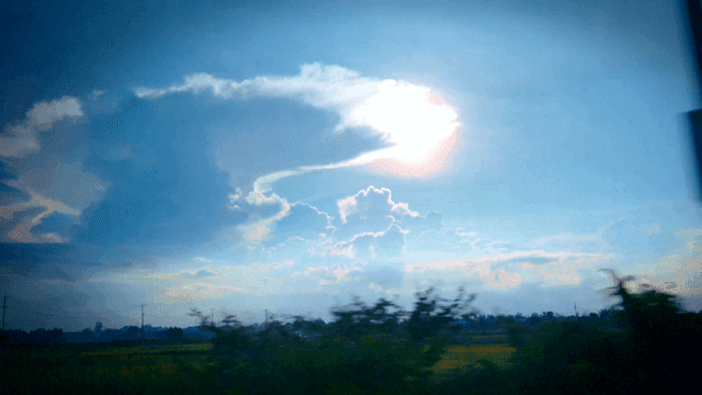 A bright sun over a vast field