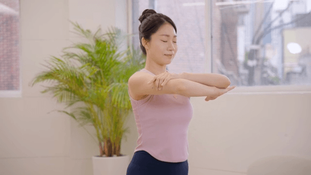Woman practicing yoga indoors