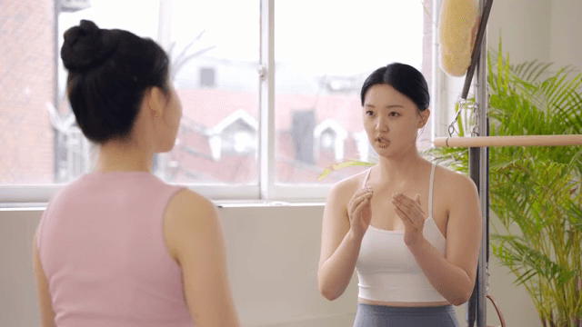 Two women having a conversation indoors