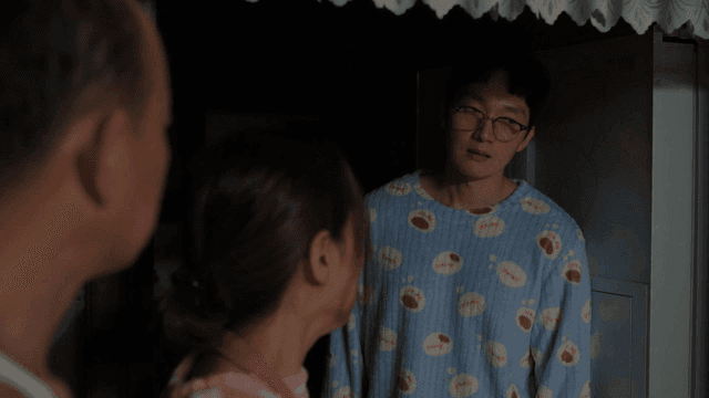 Family members in pajamas having a conversation