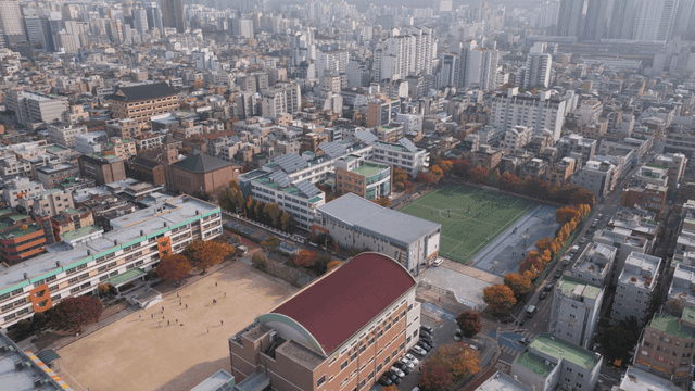 Aerial view of a city with a school