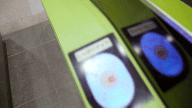 People who tag their smartphones at subway gate to enter