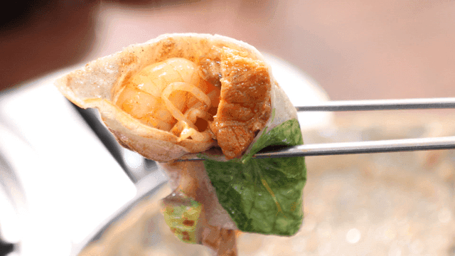 Buckwheat pancakes wrapped around meat and shrimp
