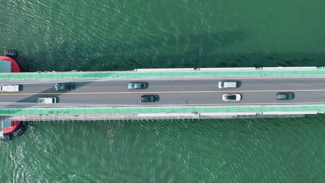 Cars driving on a bridge over water