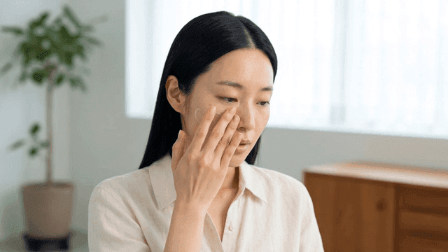 Woman applying cream