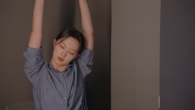 Woman stretching during a meeting