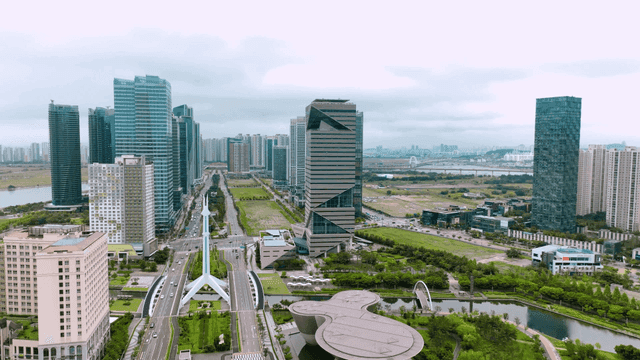 Modern cityscape with skyscrapers and greenery