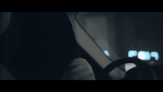 Woman driving at night