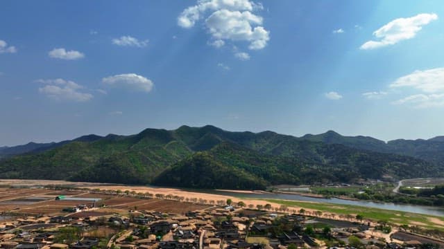 Scenic view of mountains and traditional village