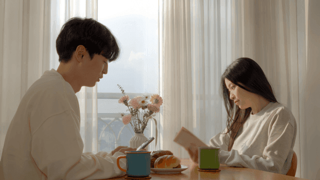 Couple starting morning talk after reading book and smartphone